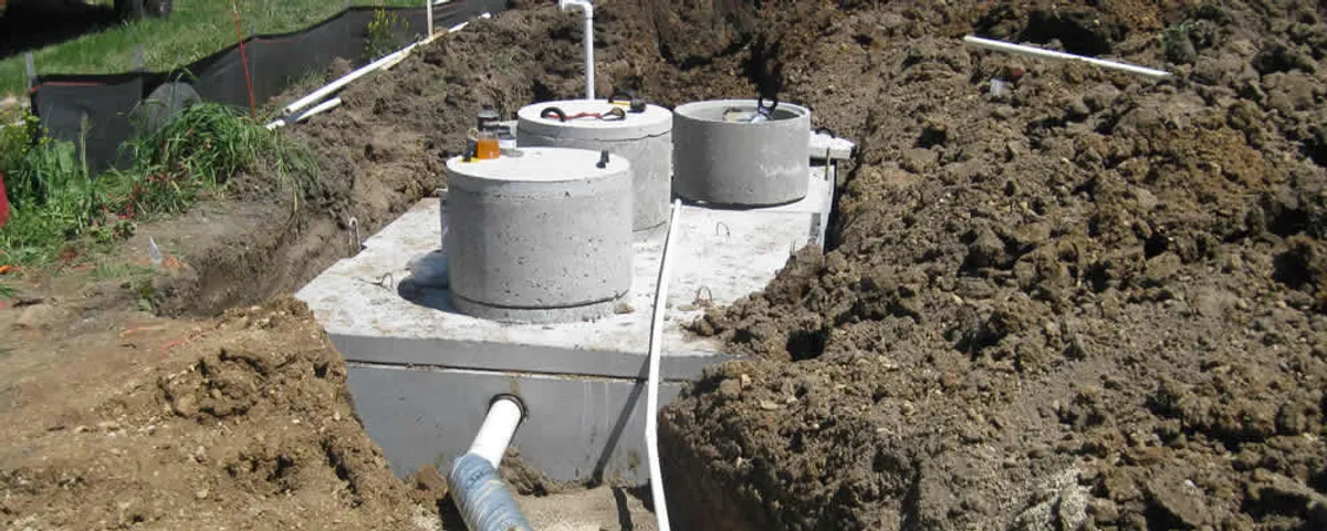 Septic system repair and installation site with tank access ports in Colorado Springs, CO